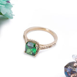 May Emerald Green Halo Cushion Cut CZ Birthstone Ring in 14k Yellow Gold - Artisan Carat