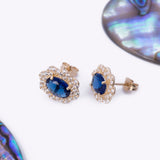 Halo Blue Sapphire Oval CZ Stud Earrings in 14k Yellow Gold - Artisan Carat