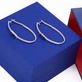 Oval Blue Sapphire and Diamond Hoop Earrings in 18k White Gold - Artisan Carat